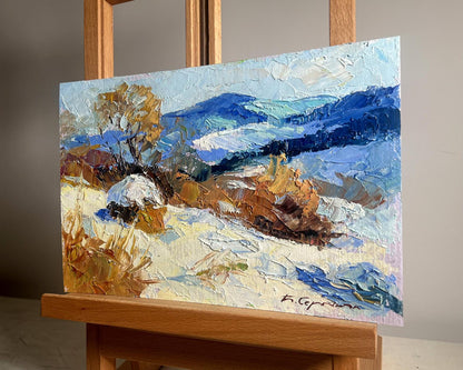 Oil painting Winter mountains by Boris Serdyuk with snow hills and autumn trees
