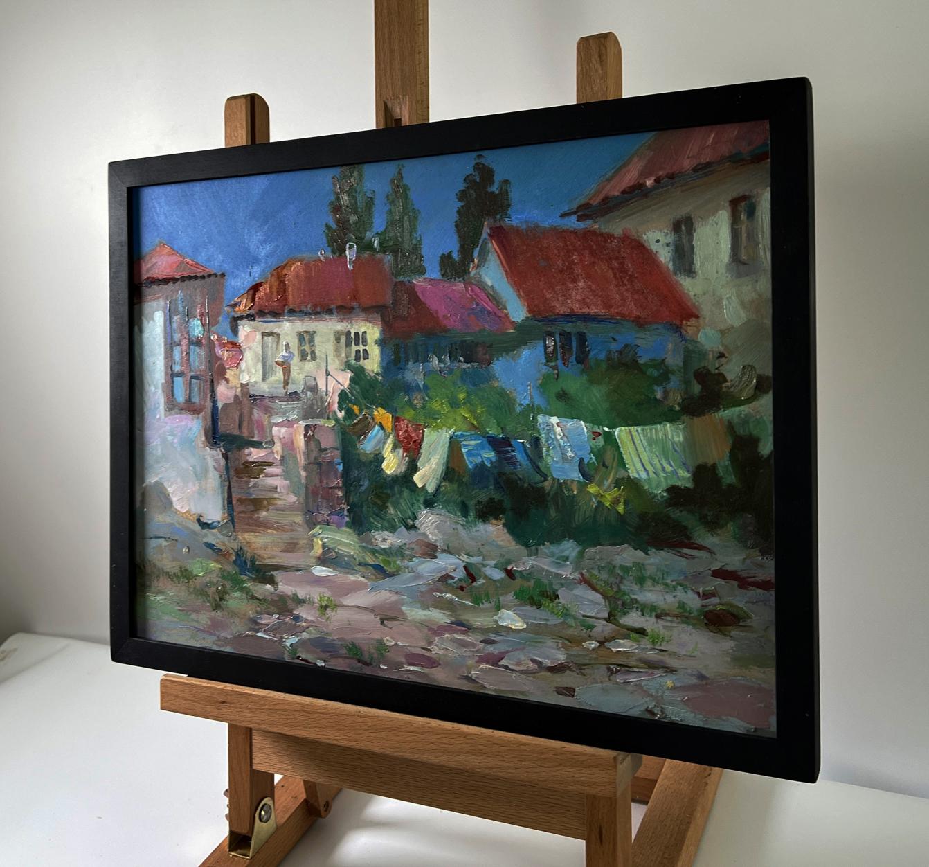 Framed oil painting of village life by Yuriy Suprunchuk