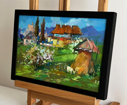 Vibrant impressionist oil painting of village garden with goat by Yuriy Suprunchuk on easel