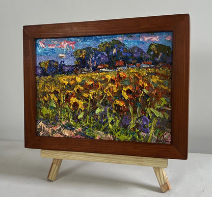 Oil painting of sunflower field in village by Oksana Ivanyuk, framed