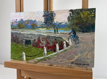 Oil painting of cyclist on mysterious evening dam by Boris Serdyuk