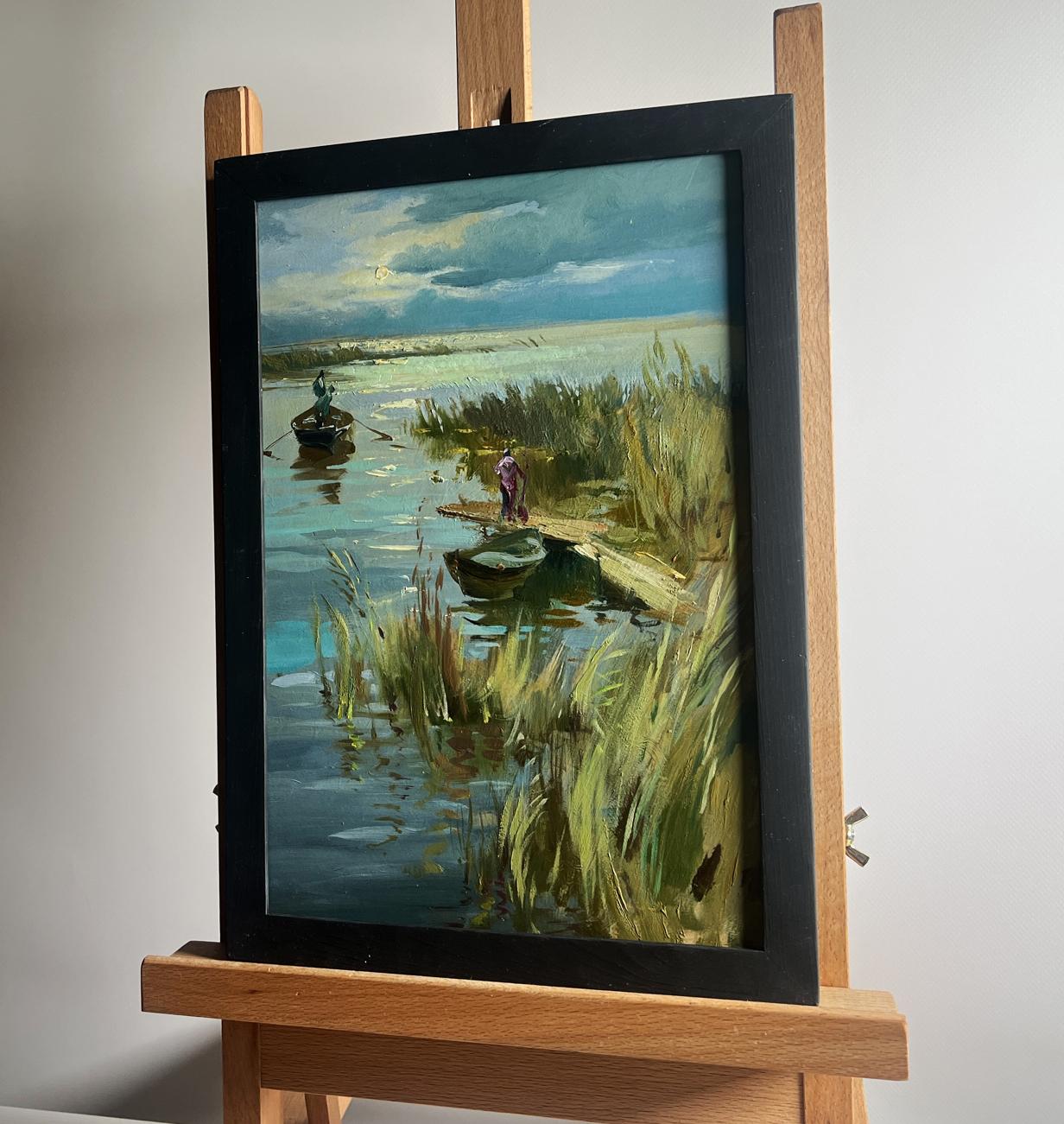 Oil painting Seeing off the Sunset by Yuriy Suprunchuk: serene lakeside with boats