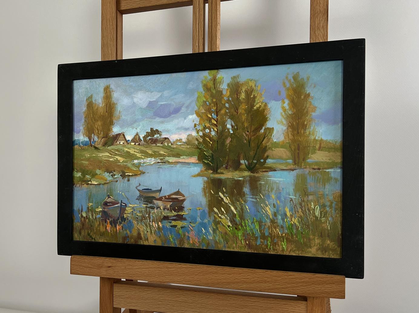Framed oil painting of serene lakeside by Yuriy Suprunchuk