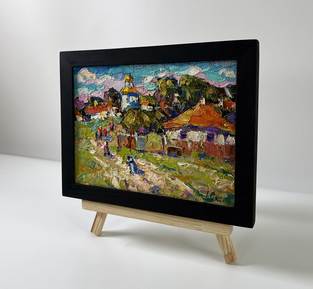 Oil painting Village Festive Day by Oksana Ivanyuk in black frame