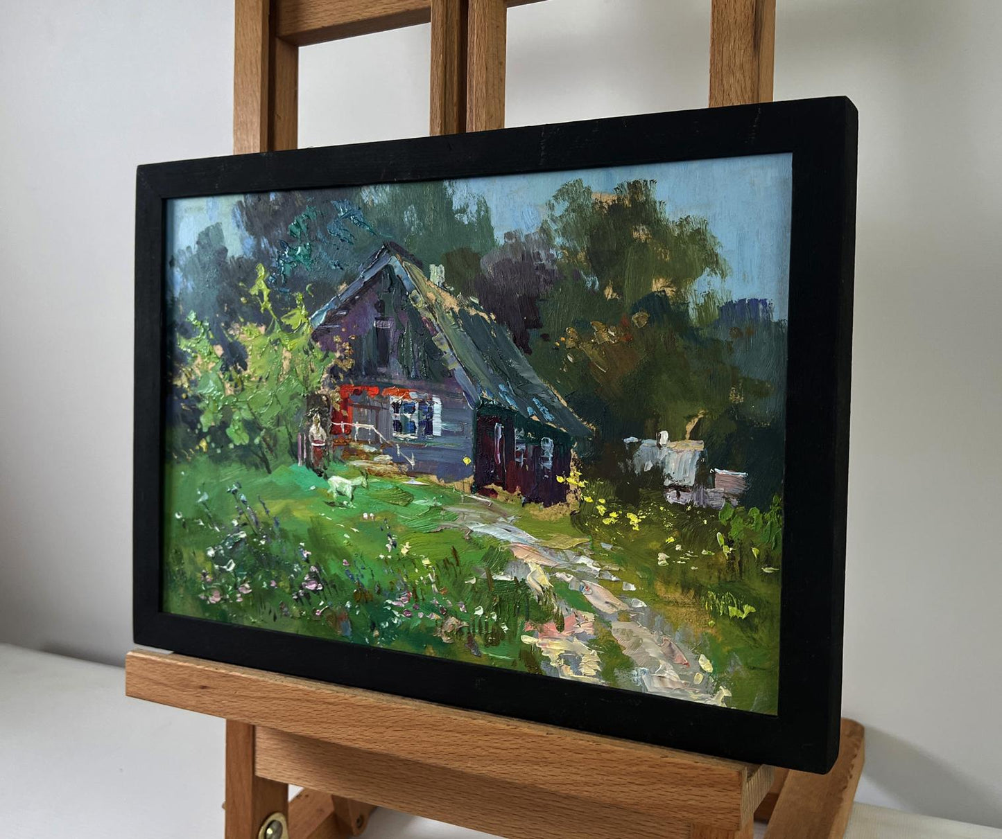 Framed oil painting of lonely house on green hill by Yuriy Suprunchuk