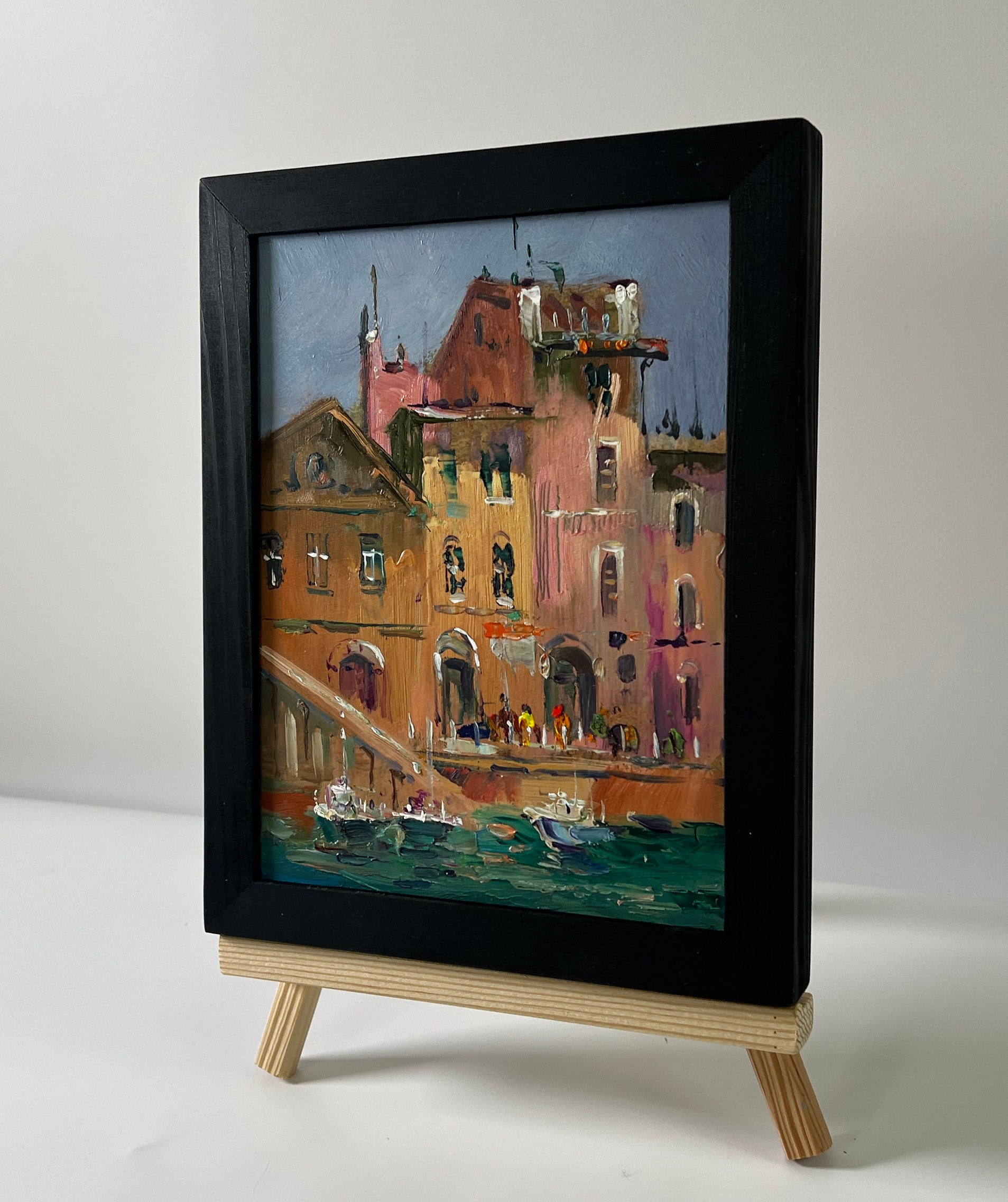 Framed oil painting of Venetian ferry boat by Yuriy Suprunchuk on easel