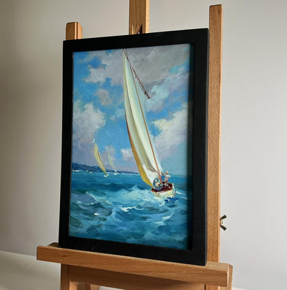 Framed oil painting of sailboat on blue waves by Yuriy Suprunchuk