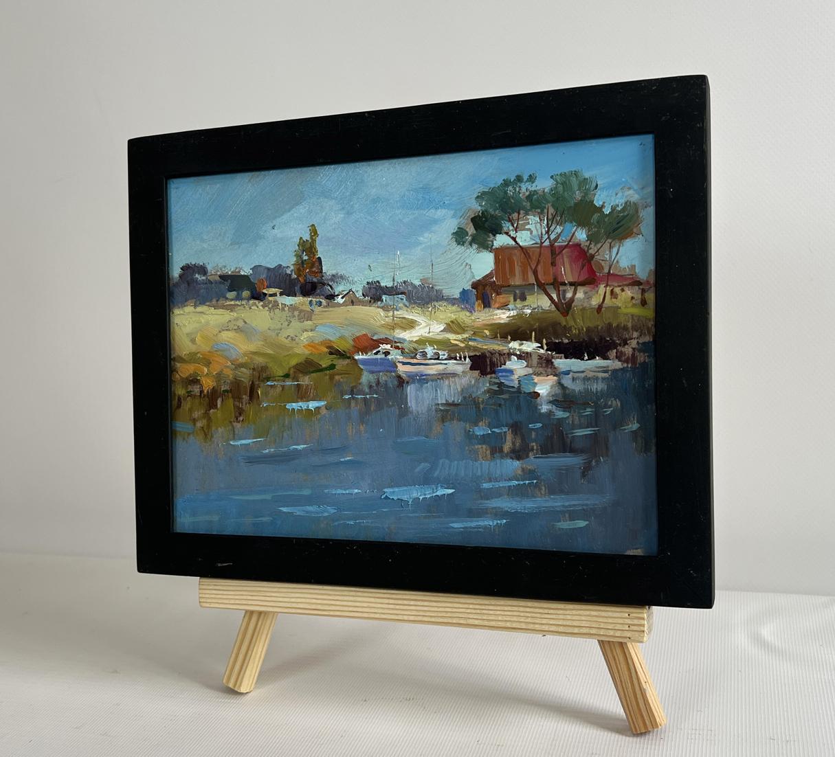 Oil painting Sailboats on the shore by Yuriy Suprunchuk on wooden easel
