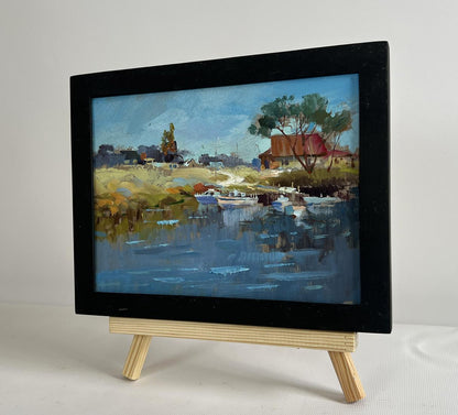 Oil painting Sailboats on the shore by Yuriy Suprunchuk on wooden easel