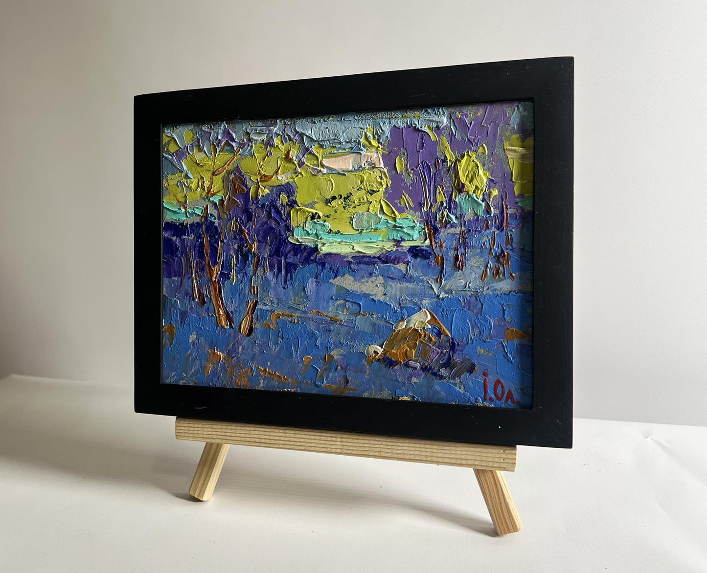Oil painting Winter evening with sunset by Oleksiy Ivanyuk in black frame