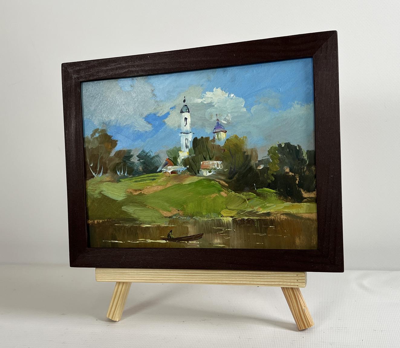 Framed oil painting of serene village church by Yuriy Suprunchuk