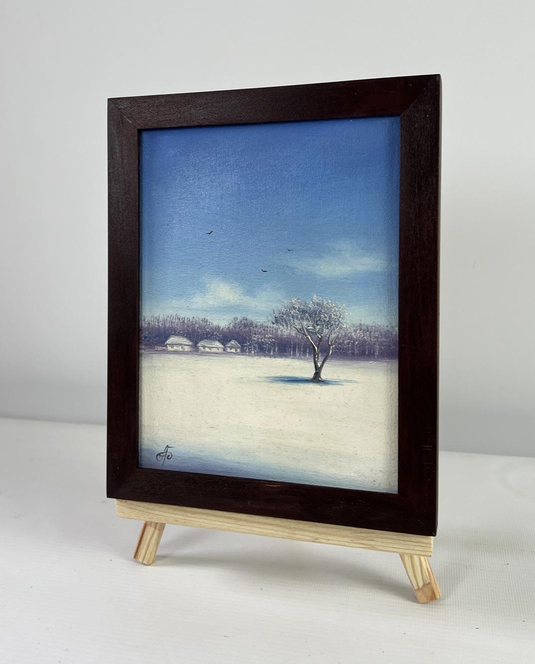 Dark wood-framed oil painting of snowy winter landscape at dawn by Andrei Bagno