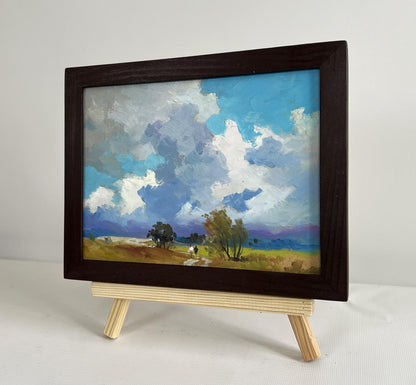 Oil painting Walking through a summer field by Yuriy Suprunchuk in dark frame