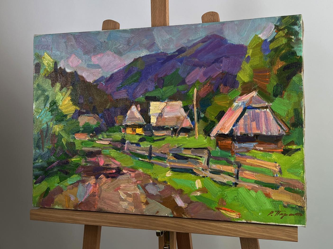 Vibrant impressionist oil painting of mountains above village by Vyacheslav Pereta on wooden easel