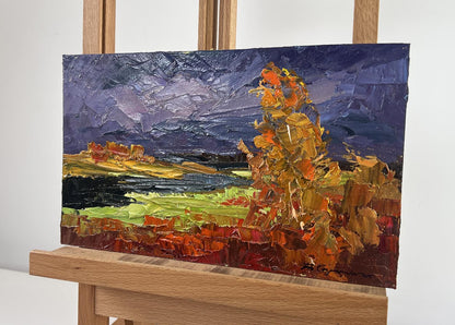 Vibrant impressionist oil painting of autumn river landscape by Boris Serdyuk on easel