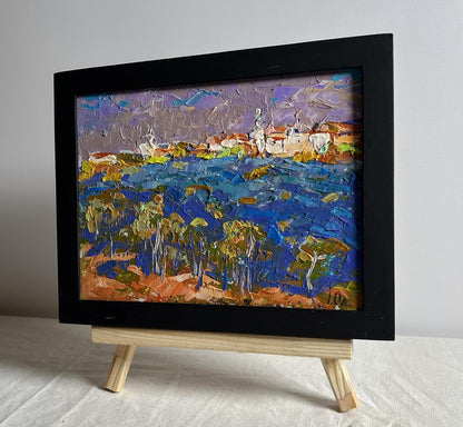 Oil painting of coastal village under grey clouds by Oleksiy Ivanyuk