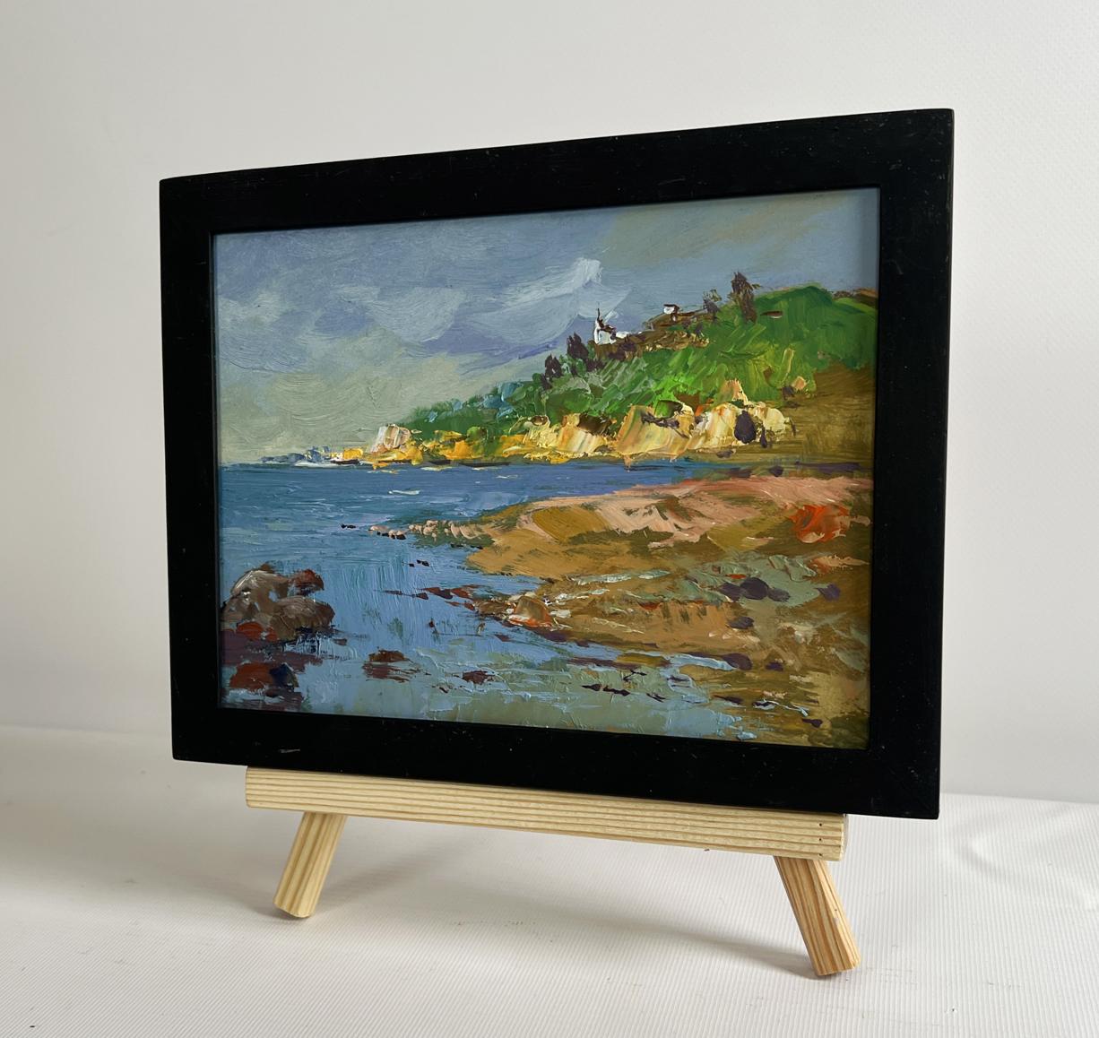 Black-framed oil painting Silence at the Foot of the Mountains by Yuriy Suprunchuk