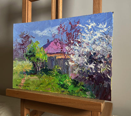 Oil painting Cherry blossom by Boris Serdyuk: rustic house with pink roof in lush greenery