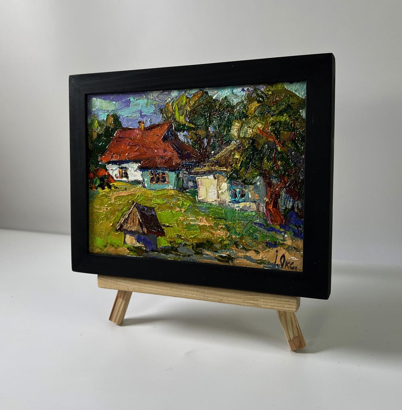 Quiet village courtyard oil painting by Oksana Ivanyuk in black frame