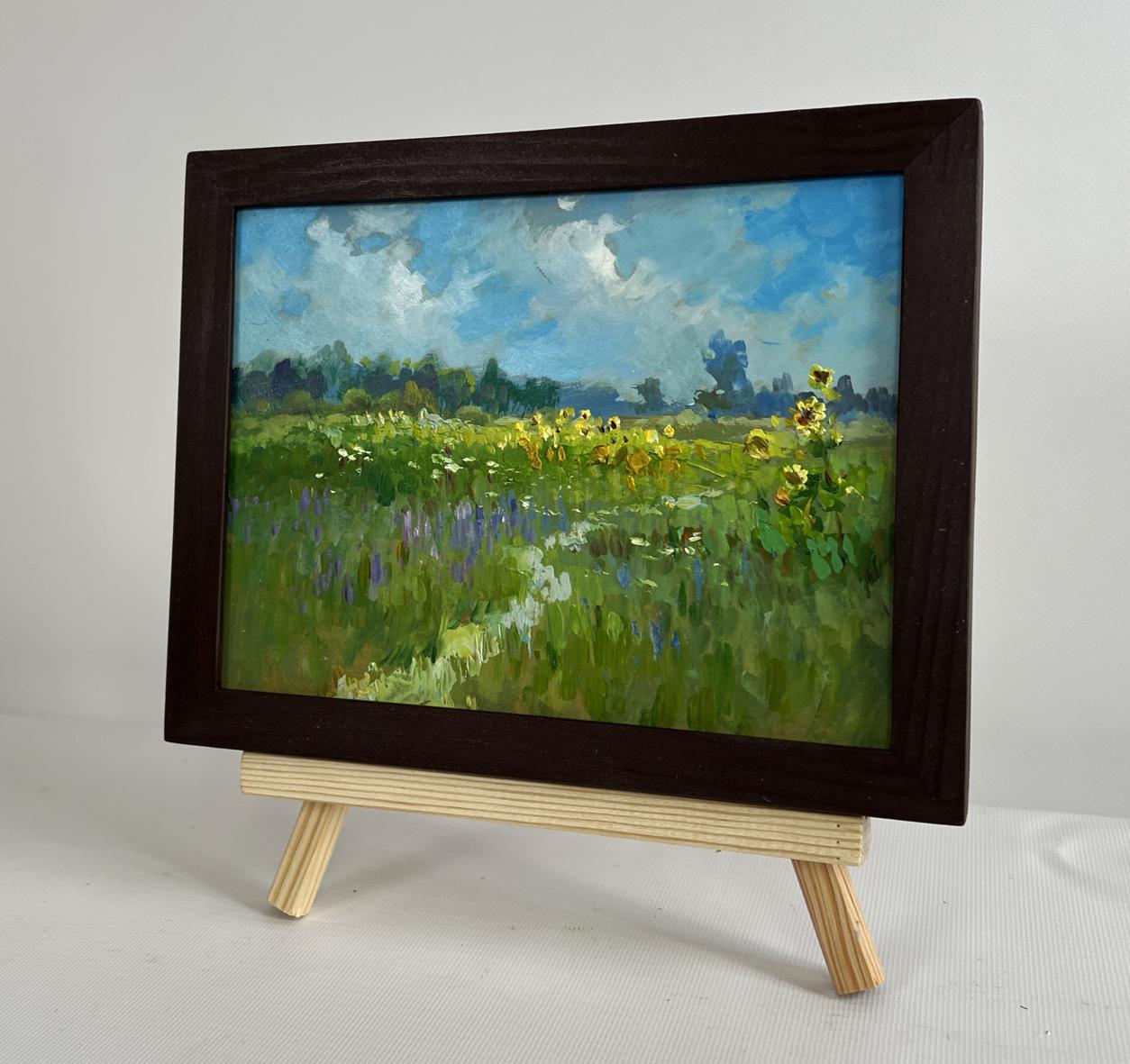 Oil painting Sunflower fields by Yuriy Suprunchuk on light wood easel