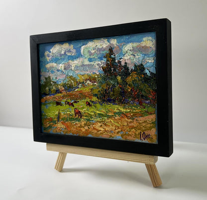 Black-framed oil painting A warm summer day by Oksana Ivanyuk