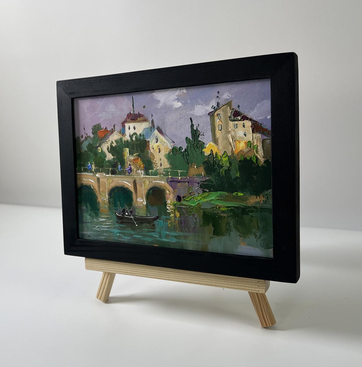 Oil painting City bridge by Yuriy Suprunchuk on wooden easel