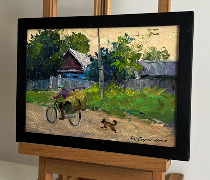 Framed oil painting by Boris Serdyuk: cyclist with green sack in rural scene