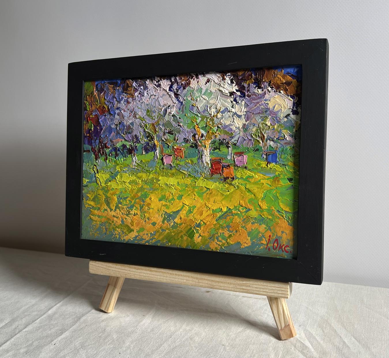 Vibrant oil painting Spring apiary by Oksana Ivanyuk on wooden easel