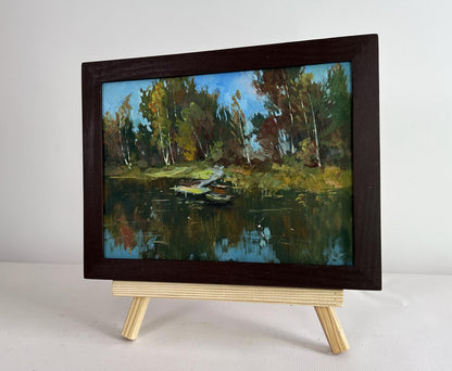 Oil painting Flowing among the trees by Yuriy Suprunchuk on easel