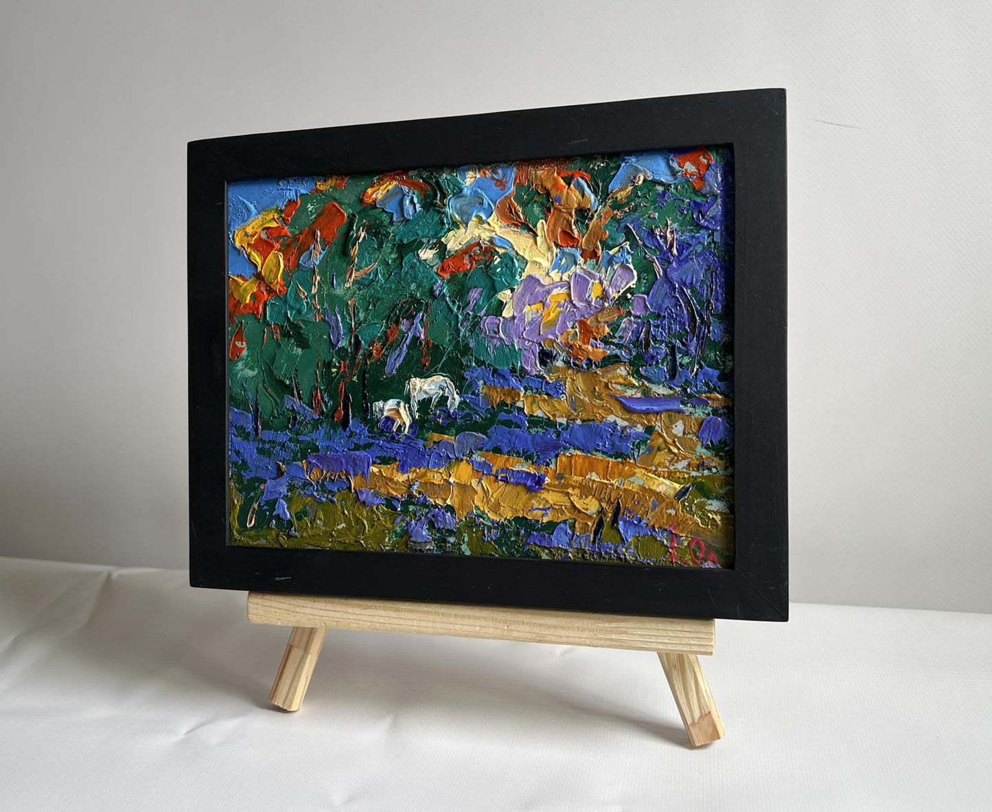 Oil painting in a forest clearing by Oleksiy Ivanyuk in black frame