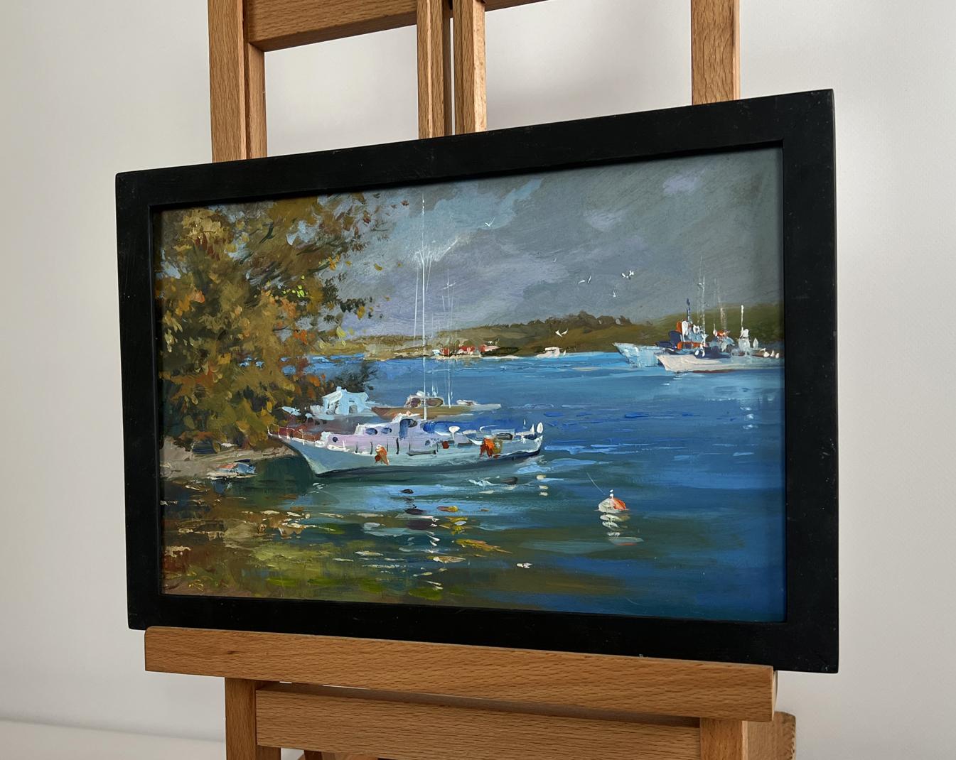 Framed oil painting of serene harbor by Yuriy Suprunchuk in black frame