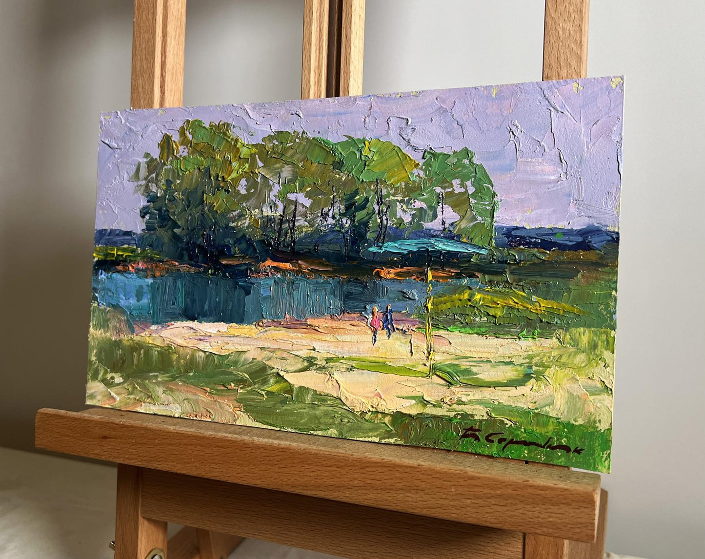 Oil painting On the golden shore by Boris Serdyuk, lush green trees and blue waterway