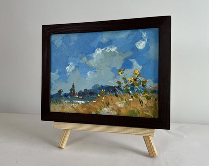Framed oil painting of sunlit sunflower field by Yuriy Suprunchuk