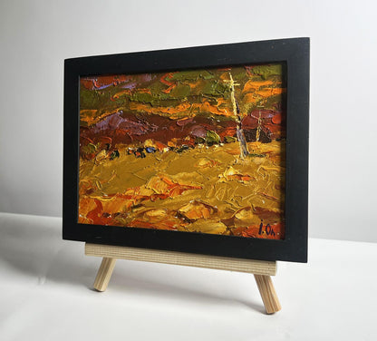 Oil painting of orange sunset over mountains by Oleksiy Ivanyuk