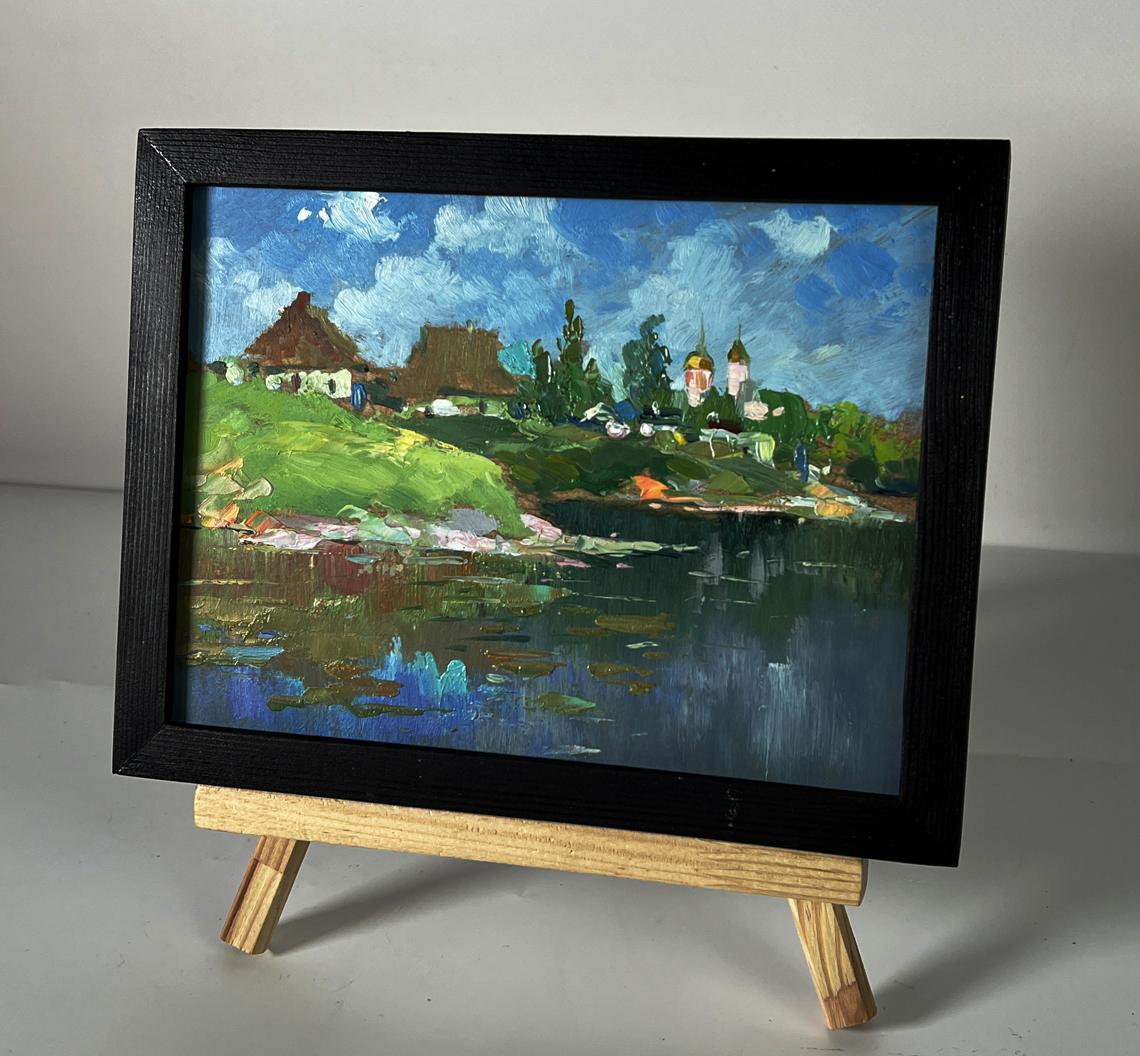 Framed oil painting of Yuriy Suprunchuk river near village with hills