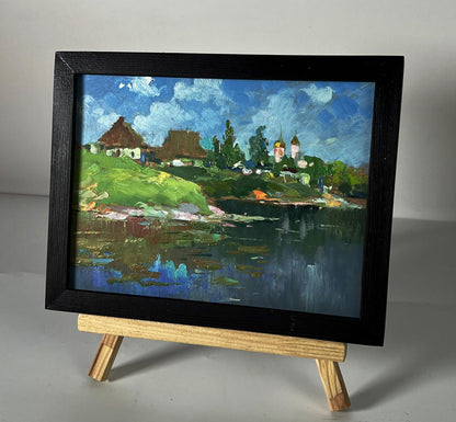 Framed oil painting of Yuriy Suprunchuk river near village with hills