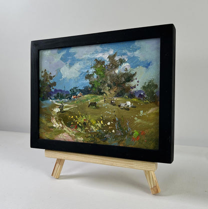 Oil painting Afternoon on the pasture by Yuriy Suprunchuk on wooden easel
