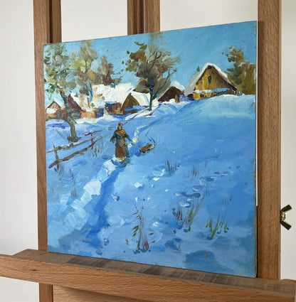 Vibrant blue oil painting Winter’s Evening Tale by Yuriy Suprunchuk snowy village scene