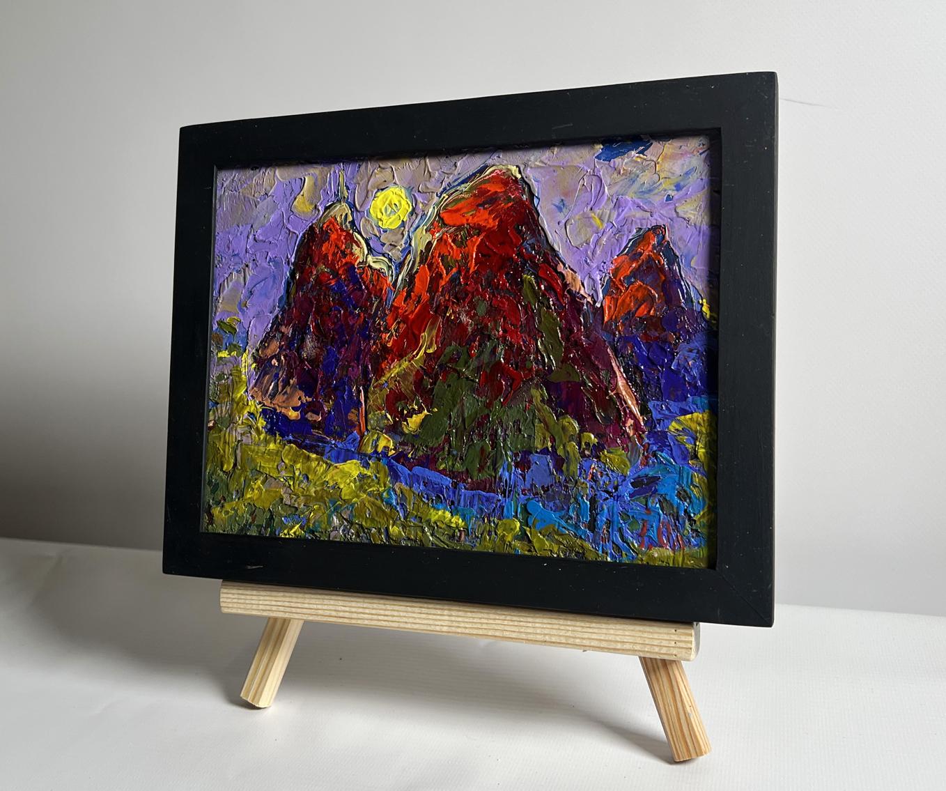 Oil painting by Oleksiy Ivanyuk: red mountains, yellow sun, purple sky in black frame
