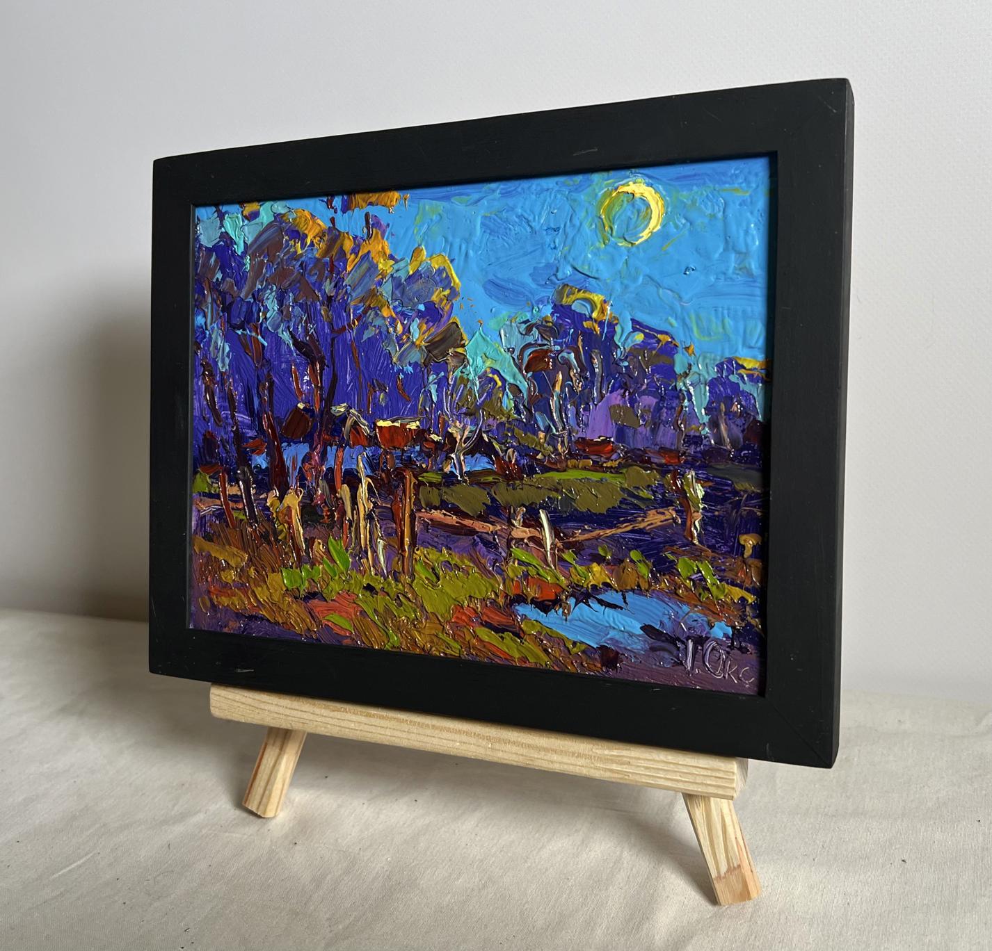 Oil painting Moonlight blue by Oksana Ivanyuk: impressionistic landscape with bold blue, purple, gold brushstrokes under crescent moon in black frame