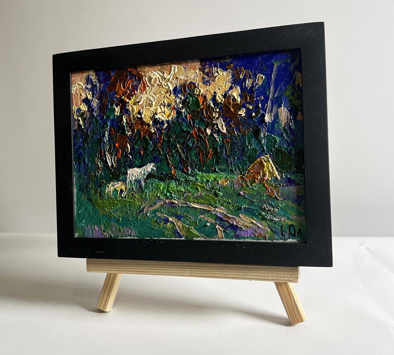Oil painting of yellow sunset behind tree branches by Oleksiy Ivanyuk in black frame