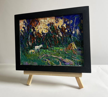 Oil painting of yellow sunset behind tree branches by Oleksiy Ivanyuk in black frame