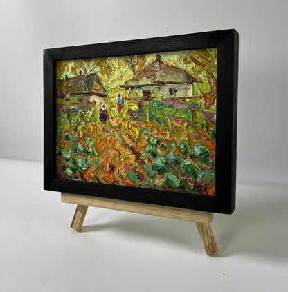 Vibrant textured oil painting of yellow sunset in village by Oleksiy Ivanyuk in black frame
