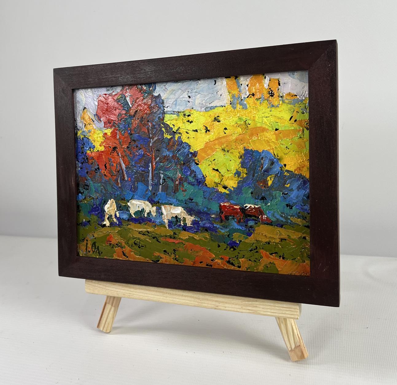 Vibrant impressionist oil painting of cows under colorful trees by Oleksiy Ivanyuk in wooden frame