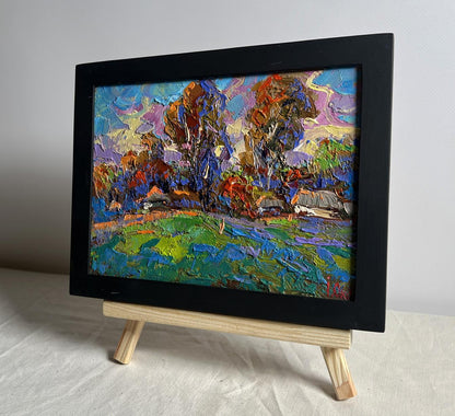 Oil painting of autumn village by Oksana Ivanyuk in black frame