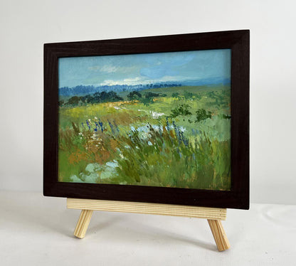 Oil painting On the summer flower meadows by Yuriy Suprunchuk on easel