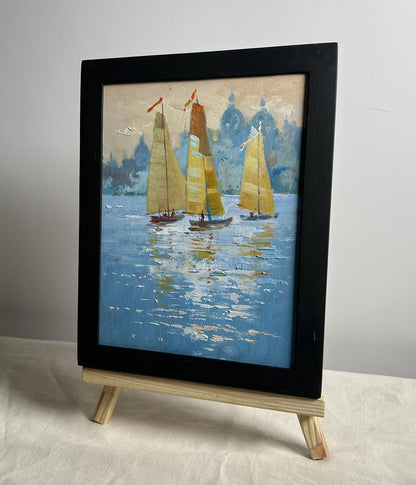 Oil painting of three sailboats in evening by Yuriy Suprunchuk in black frame