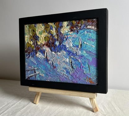 Oil painting of large snowdrifts by Oleksiy Ivanyuk in black frame
