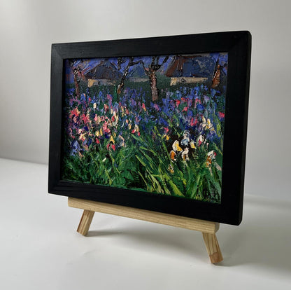 Oil painting Flowers in the village by Oleksiy Ivanyuk: black-framed irises