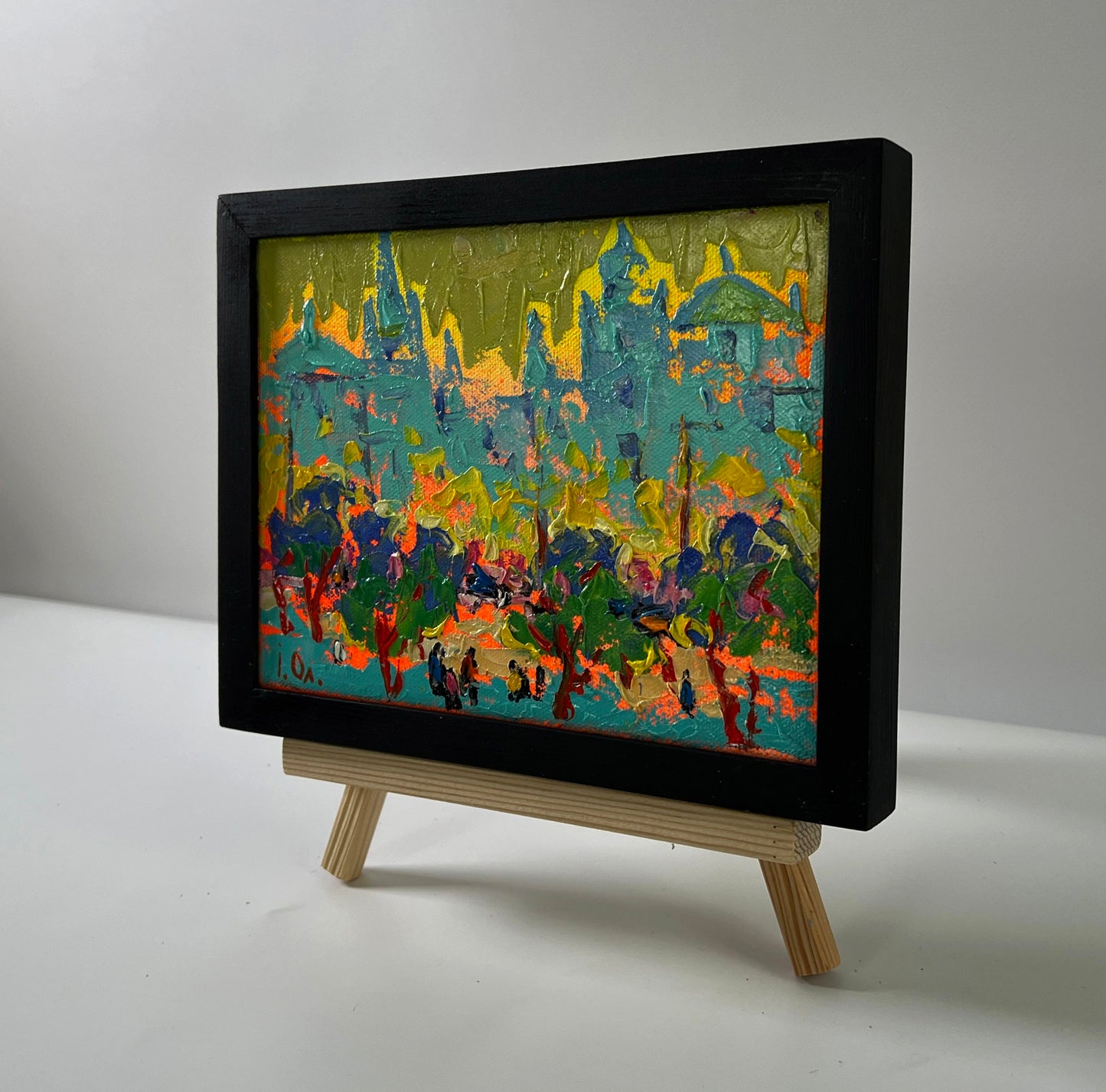 Oil painting City in the rays of sunset by Oleksiy Ivanyuk in black frame
